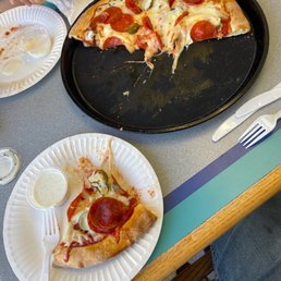 Pizza with pineapple, peppers, and pepperoni Pizza with pineapple, peppers, and pepperoni
