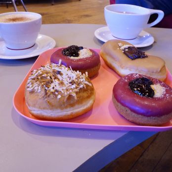 Glam Doll Donuts - Cosmopolitan girl (long John), Femme Fatale (raspberry) and coconut toasted topping donut. These are definitely my faves. - Donuts Near Me - Minneapolis, Minnesota