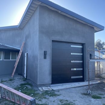 ESM Garage Doors - Flush woodgrain with thin vertical frosted glass. - Garage Door Services Near Me ESM Garage Doors - Flush woodgrain with thin vertical frosted glass. - Garage Door Services Near Me
