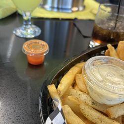 Lonell's Soul Food Cuisine - Please use hot sauce bottles. I was given one cup. You know this isn't enough!