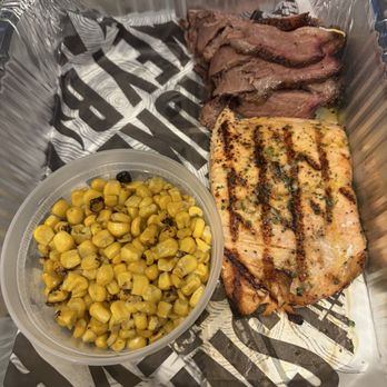 Smokey Bones Ronkonkoma - salmon, dinner with corn and brisket side - American Near Me - Ronkonkoma, New York