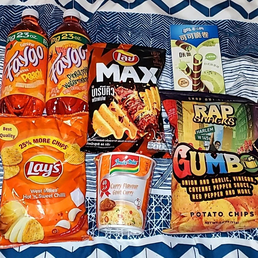 a variety of snacks on a bed