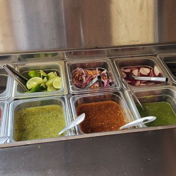 Sebastian's Taqueria - salsa Bar. The salsa on the far left is for chips. And starting from the left side is mild to spicy. - Mexican Near Me - Bakersfield, California