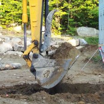 Forrest Excavation - an excavator digging a hole - Masonry/Concrete Near Me - Mt Vernon, Maine