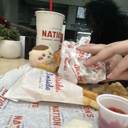 Kurimanju enjoying cheese burger and fries Kurimanju enjoying cheese burger and fries
