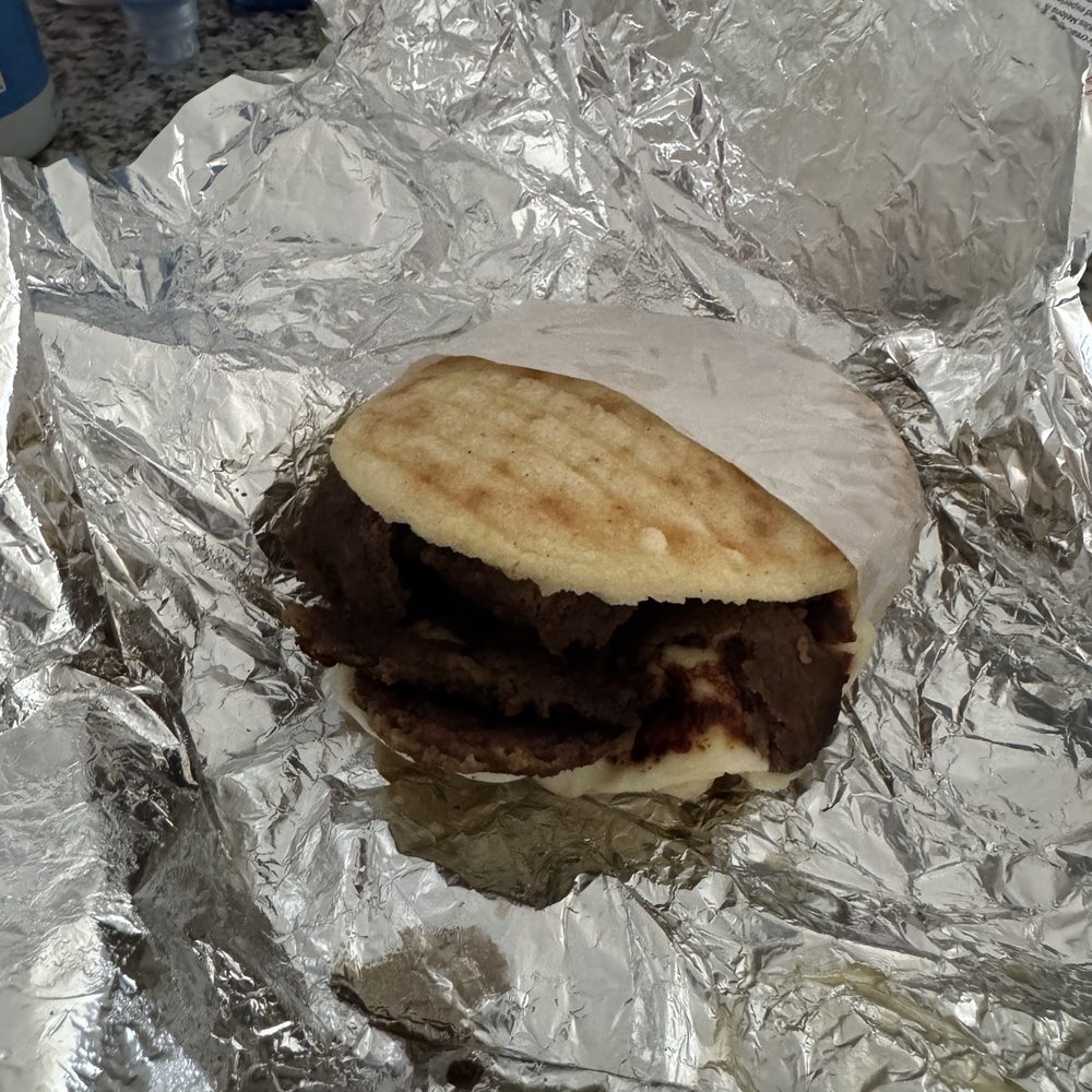 The Arepa Station - Carne asada with grilled cheese slice - Latin American Near Me - Orlando, Florida The Arepa Station - Carne asada with grilled cheese slice - Latin American Near Me - Orlando, Florida