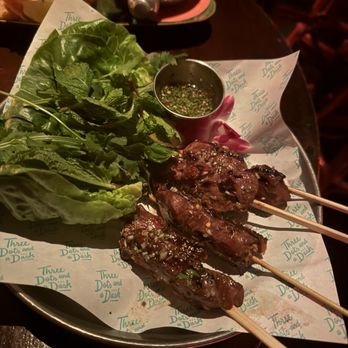 Three Dots and A Dash - Marinated Prime Beef Skirt Skewers with Magic Mustard - Asian Fusion Near Me - Chicago, Illinois Three Dots and A Dash - Marinated Prime Beef Skirt Skewers with Magic Mustard - Asian Fusion Near Me - Chicago, Illinois