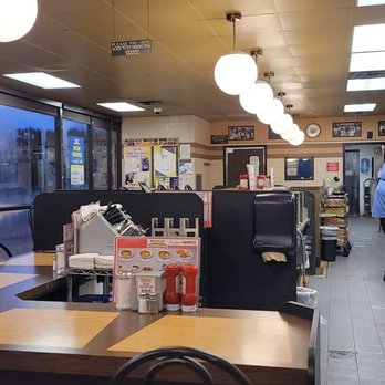 Waffle House - a man standing in the kitchen - Diners Near Me - Cumming, Georgia