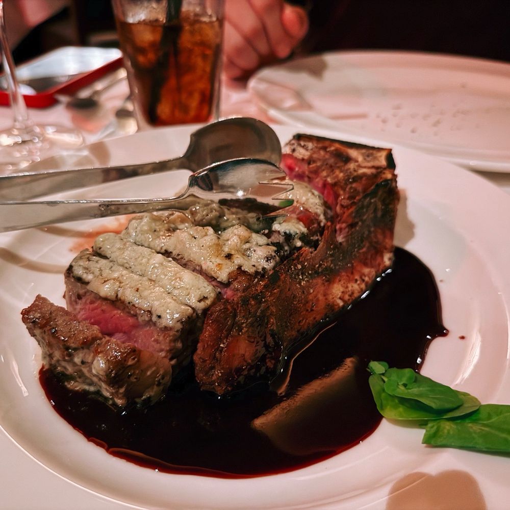 The Capital Grille - Gorgonzola-Crusted Dry Aged Bone-In NY/KC Strip with Cabernet Reduction - Steakhouses Near Me - Burbank, California The Capital Grille - Gorgonzola-Crusted Dry Aged Bone-In NY/KC Strip with Cabernet Reduction - Steakhouses Near Me - Burbank, California