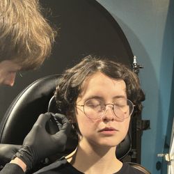 Blue Luna Tattoo Company - Noah piercing ears