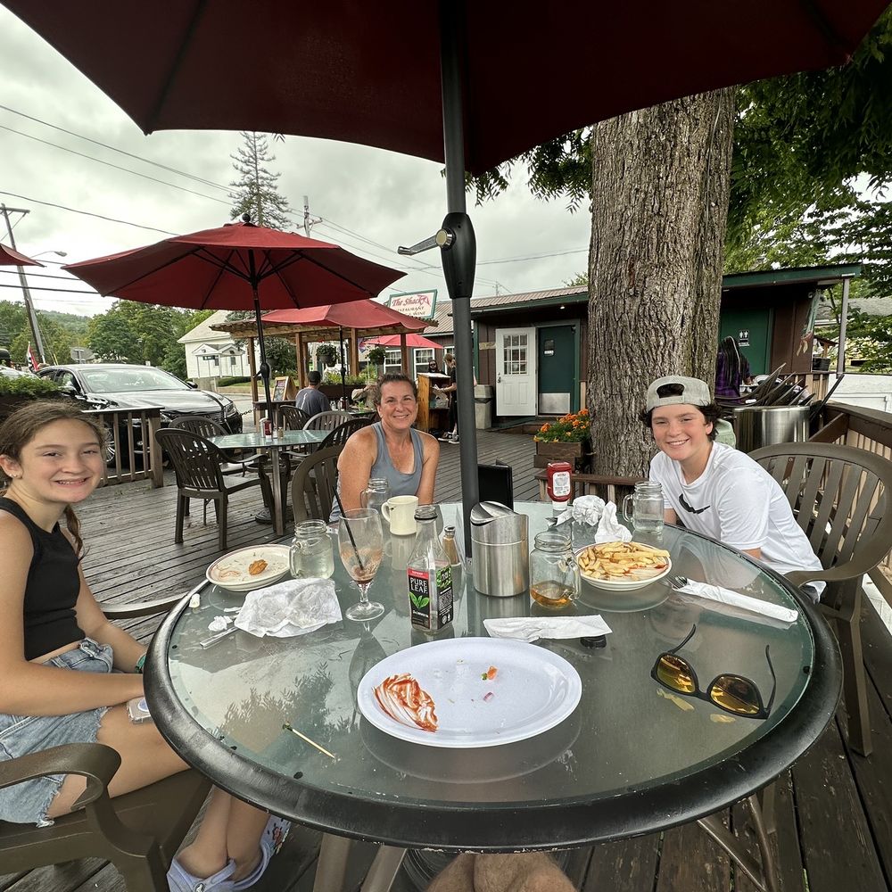 a group of people sitting at a table a group of people sitting at a table