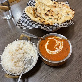Saffron Indian Bistro - Butter chicken and homemade garlic naan. - Indian Near Me - Banff, Alberta