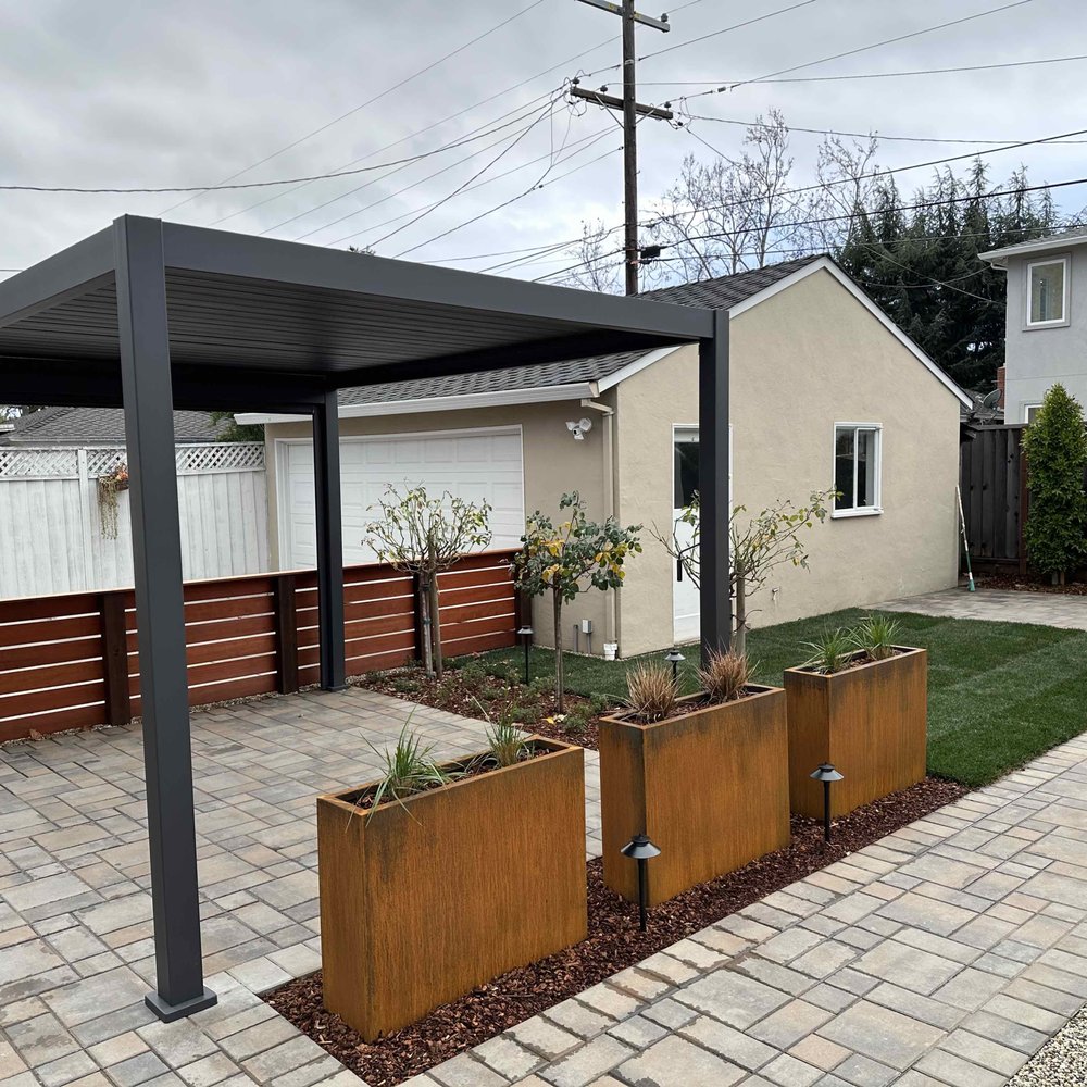 Total Landscape - a backyard with a pergol roof - Landscaping Near Me Total Landscape - a backyard with a pergol roof - Landscaping Near Me