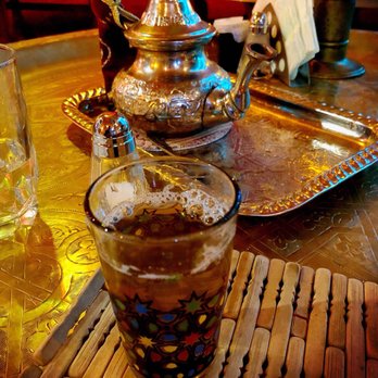 Salon Mogador - a teapot and a glass of tea - Moroccan Near Me - Montreal, Quebec Salon Mogador - a teapot and a glass of tea - Moroccan Near Me - Montreal, Quebec