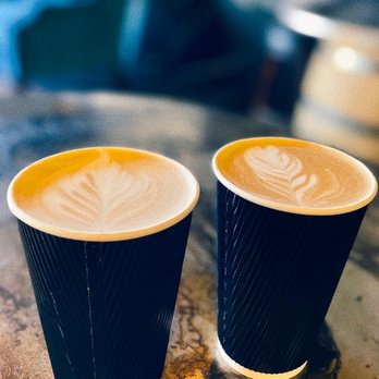 Common Grounds - two cups of coffee on a table - Coffee & Tea Near Me - Greensboro, North Carolina Common Grounds - two cups of coffee on a table - Coffee & Tea Near Me - Greensboro, North Carolina