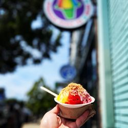 Ululani's Hawaiian Shave Ice - My yummy keiki size shave ice - cherry/banana/passion orange with snow cap and toasted coconut toppings
