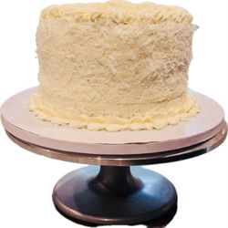 Coconut Dream Delight, Moist gluten-free and eggless coconut cake layered with silky coconut buttercream, then covered in sweet shredded coc