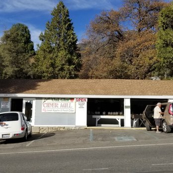 Laws Cider Mill - two men standing outside of a building - Cideries Near Me - Oak Glen, California
