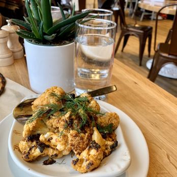 True Food Kitchen - Charred Cauliflower-harissa tahini, medjool date, dill, mint, pistachio- This is a Must! We loved it so much we Ordered 2.. - New American Near Me - Oakbrook, Illinois