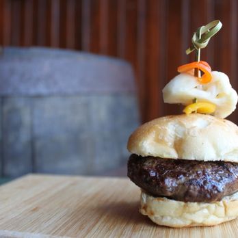 Tautog Tavern - a burger on a wooden board - Bars Near Me - Bridgeport, Connecticut Tautog Tavern - a burger on a wooden board - Bars Near Me - Bridgeport, Connecticut