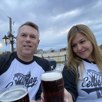 Celtic Ray Irish Pub - My beautiful wife, Silvia, and our proudly displayed Celtic Ray shirts. - Irish Near Me - Punta Gorda, Florida