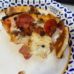 Domino's Pizza - Green fly baked into pizza. Was offered store credit, no refund.