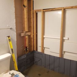 Pick Stone Construction - Old tub and shower stripped down and prepped for new shower