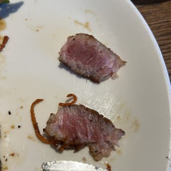 Grackle - these are pieces from the second porkchop that was brought out. the meat was still raw which was disappointing. - Cocktail Bars Near Me - Maple Grove, Minnesota