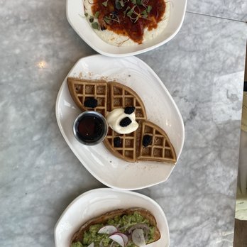 Jane Q - three plates of food on a marble table - Mediterranean Near Me - Hollywood, California Jane Q - three plates of food on a marble table - Mediterranean Near Me - Hollywood, California