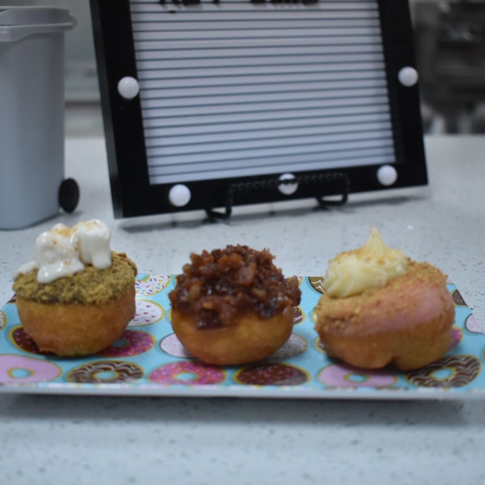 Van Dough - Left to right: s'mores, sweet piggy, New York cheesecake - Donuts Near Me - Clearwater, Florida Van Dough - Left to right: s'mores, sweet piggy, New York cheesecake - Donuts Near Me - Clearwater, Florida