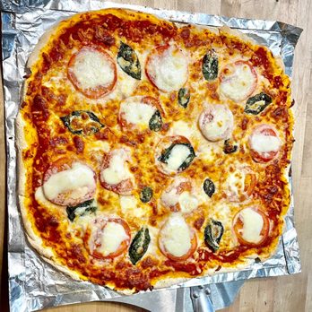 B, Pizza - a freshly baked pizza on aluminum foil - Pizza Near Me - Conover, Ohio