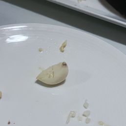 Mushroom hummus served with a clove of fresh garlic