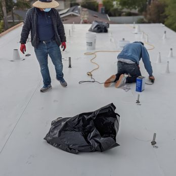 Premium Roofing Systems - New flat roof- Protecting / Water Proofing solar panel brackets - Roofing Near Me - Santa Ana, California Premium Roofing Systems - New flat roof- Protecting / Water Proofing solar panel brackets - Roofing Near Me - Santa Ana, California