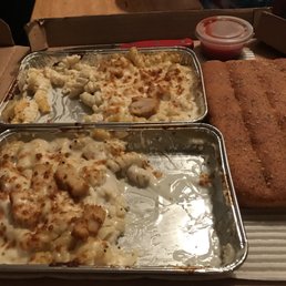 two pans of macaroni and cheese