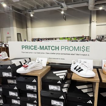 DSW Designer Shoe Warehouse - The sign showing price match promise - Shoe Stores Near Me - Northridge, California DSW Designer Shoe Warehouse - The sign showing price match promise - Shoe Stores Near Me - Northridge, California