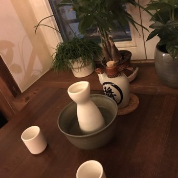 Secret Garden - Sake coming in a bowl of warm water - Sushi Bars Near Me - Berlin, BE