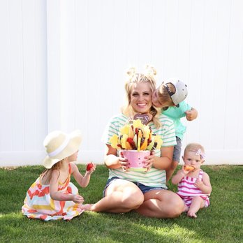 Edible Arrangements - a woman sitting on the grass with her children - Gift Shops Near Me - Lithonia, Georgia Edible Arrangements - a woman sitting on the grass with her children - Gift Shops Near Me - Lithonia, Georgia
