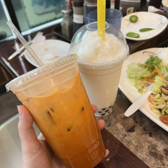 Pho Ever & Wok - a person holding a plastic cup of iced tea - Vietnamese Near Me - Puyallup, Washington