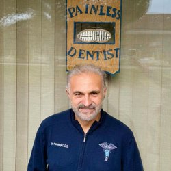 Family Dental Center of Connecticut - Our hand-painted Painless Dentist sign - we do our best to live up to it.