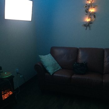 Essentials Retreat - Couch, tv and fireplace to relax while waiting. - Skin Care Near Me - Seminole, Florida