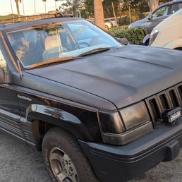 1994 Jeep Grand Cherokee door hinge repaired by Encinitas Auto Body.