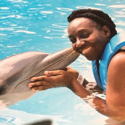 Wildwood Natural Food Market - A dolphin and me enjoying nature, sunshine and air in the pool.,