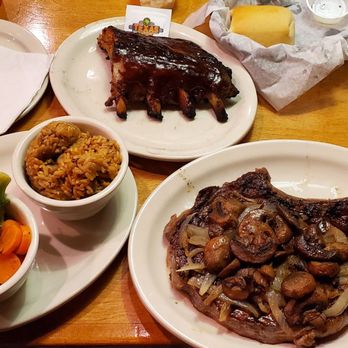 Texas Roadhouse - 20 oz. Bone-In Ribeye with sautéed mushrooms and onions done medium-rare, fresh vegetables, rice, ribs. - Steakhouses Near Me - Watertown, New York