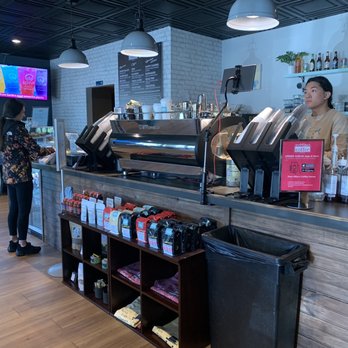 Pour Mike's Coffee House - Front counter and espresso machine with barista - Coffee & Tea Near Me - Saint Johns, Florida