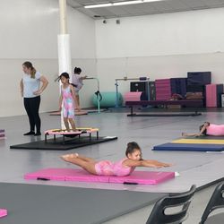 Hudson Gymnastics - Every kid is at a different station fine tuning their skills!