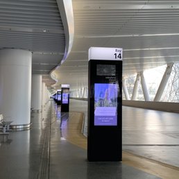 View of transit bays giving a liminal feel to the upper bus level without people View of transit bays giving a liminal feel to the upper bus level without people
