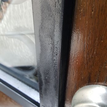 Ricks Front Door Refinishing - This shows the frame of the window which they attempted to repair. They ruined the finish then tried to "fix" it with spray paint. - Refinishing Services Near Me - Pasadena, Texas