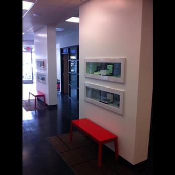 Clear View Builders - a hallway with a red bench - General Contractors Near Me