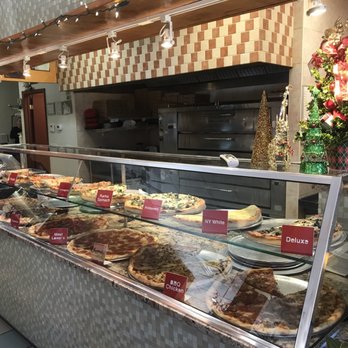 New York Pizza Plus - The counter with the pies - Italian Near Me - Alachua, Florida New York Pizza Plus - The counter with the pies - Italian Near Me - Alachua, Florida