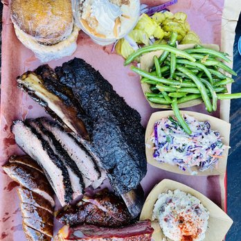 Terry Black's Barbecue - Beef brisket, beef rib, sausage, pork spare ribs. Sides: potato salad, cole slaw, green beans, pickles and onions - Barbeque Near Me - Austin, Texas